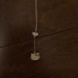 a little girl hello kitty necklace
